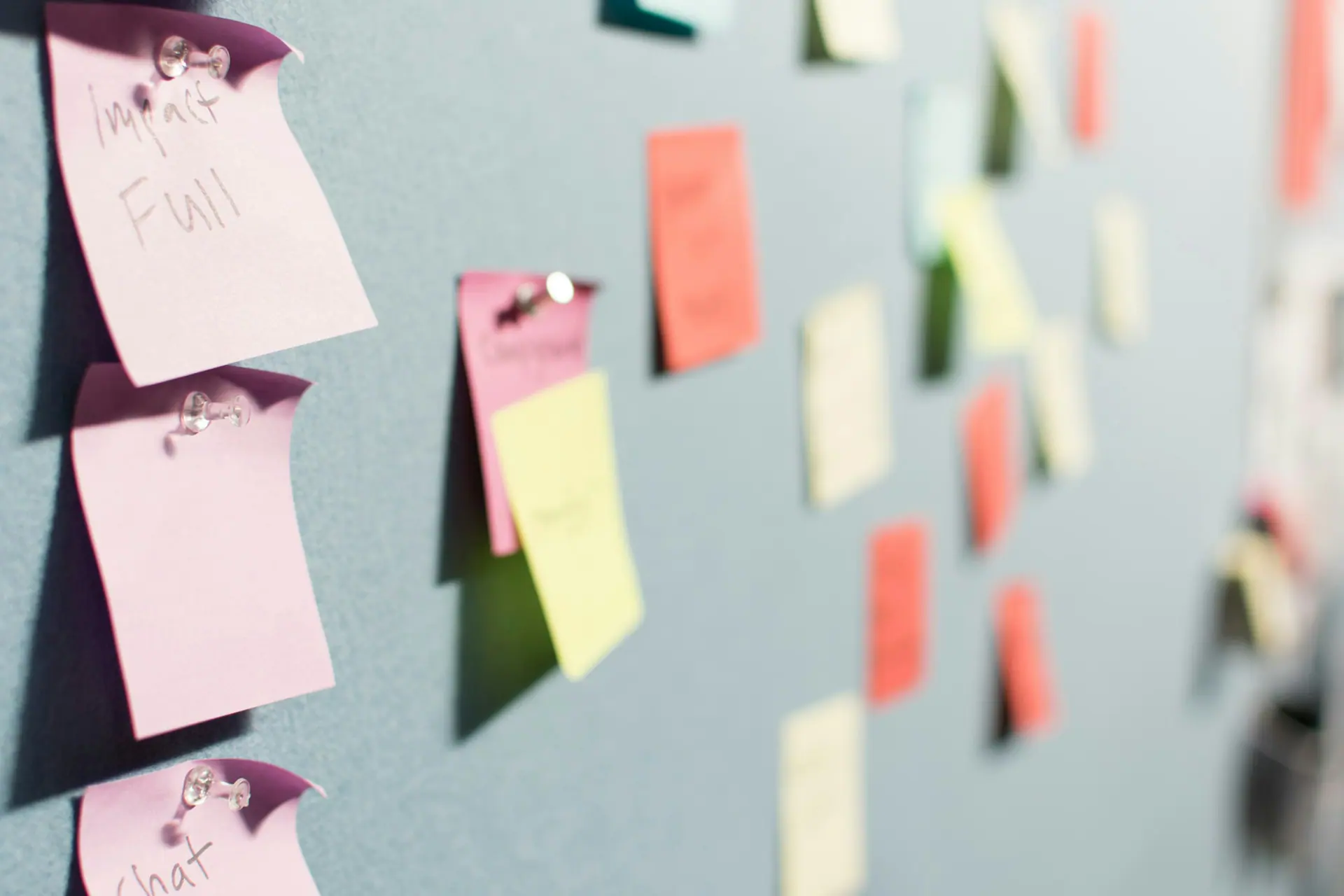 Colourful sticky notes pinned across a planning board