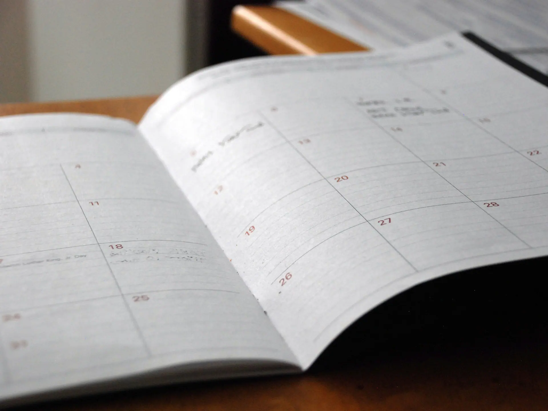 Open monthly planner with blank week rows waiting to be filled in